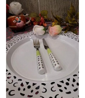 کارد و چنگال دسته سرامیکی طرح گل بنفش کارد و چنگال دسته سرامیکی طرح گل بنفش